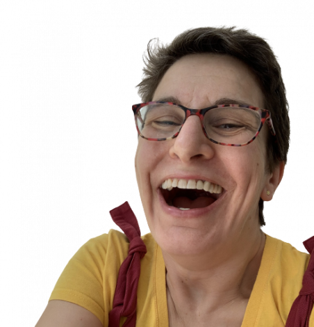 Woman's face with glasses on laughing